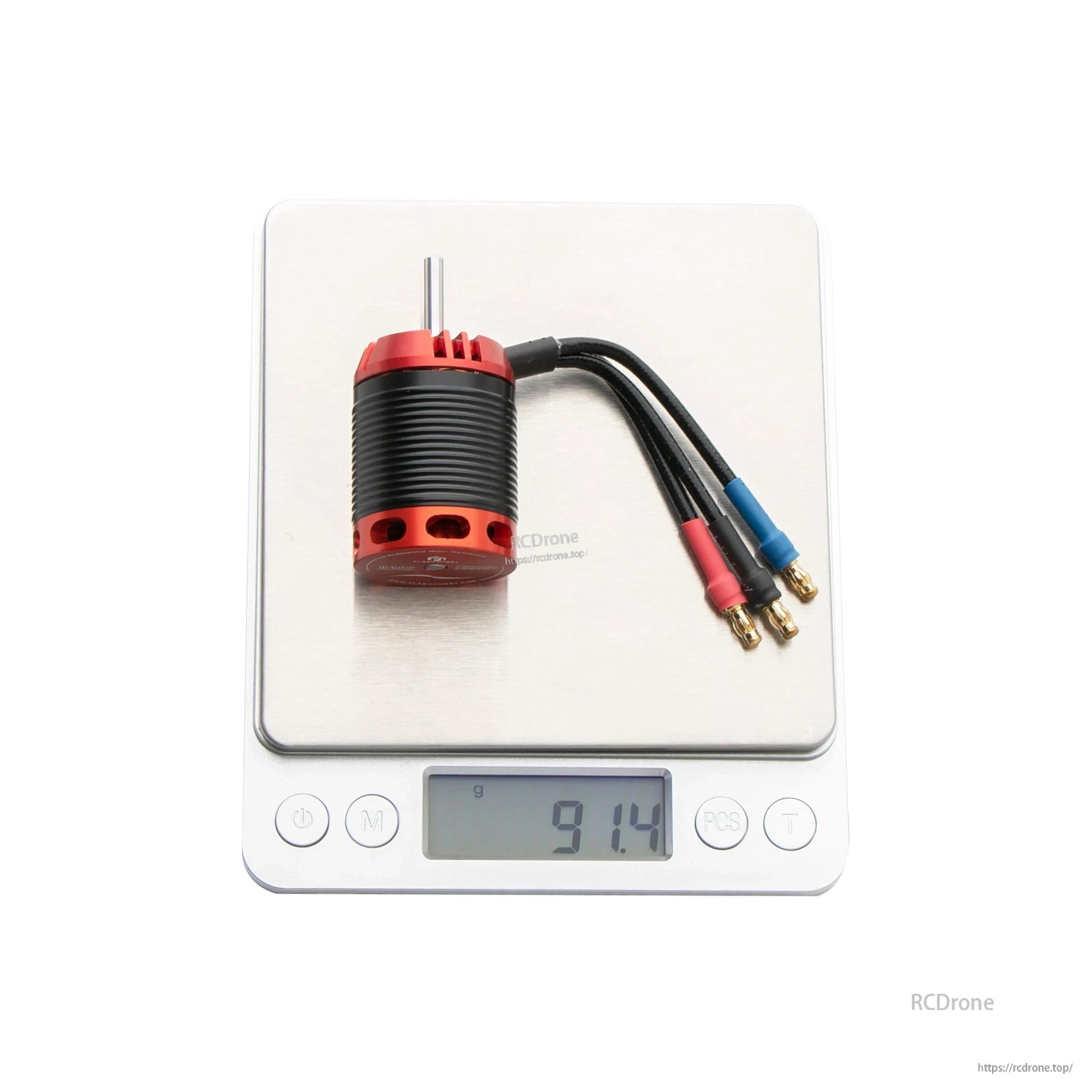 Flashhobby H450 Helicopter Motor, Flashhobby H450 brushless helicopter motor with 3-wire bullet connectors on a digital scale reading 91.4 g