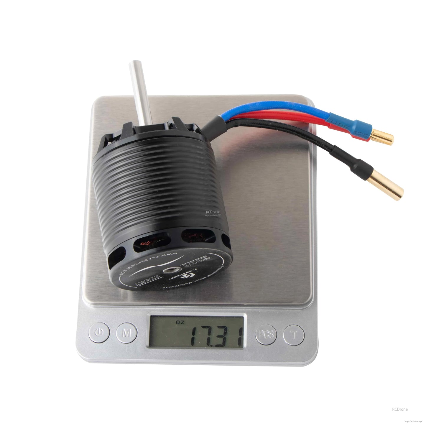 Flashhobby H700 530KV Helicopter Motor, Flashhobby H700 brushless helicopter motor with 6mm shaft and bullet connectors on a scale reading 17.31 oz