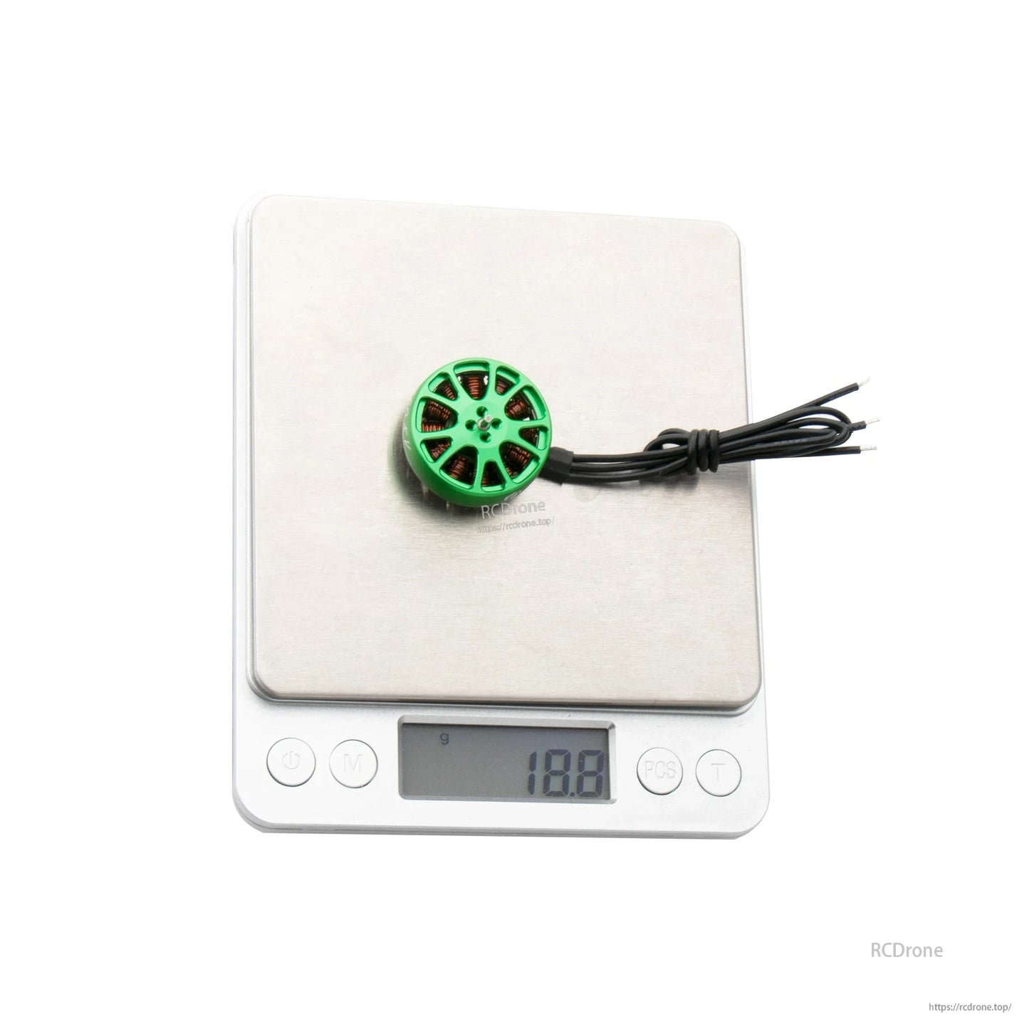 Flashhobby K2303 1750KV brushless motor with green top on a digital scale reading 18.8 g