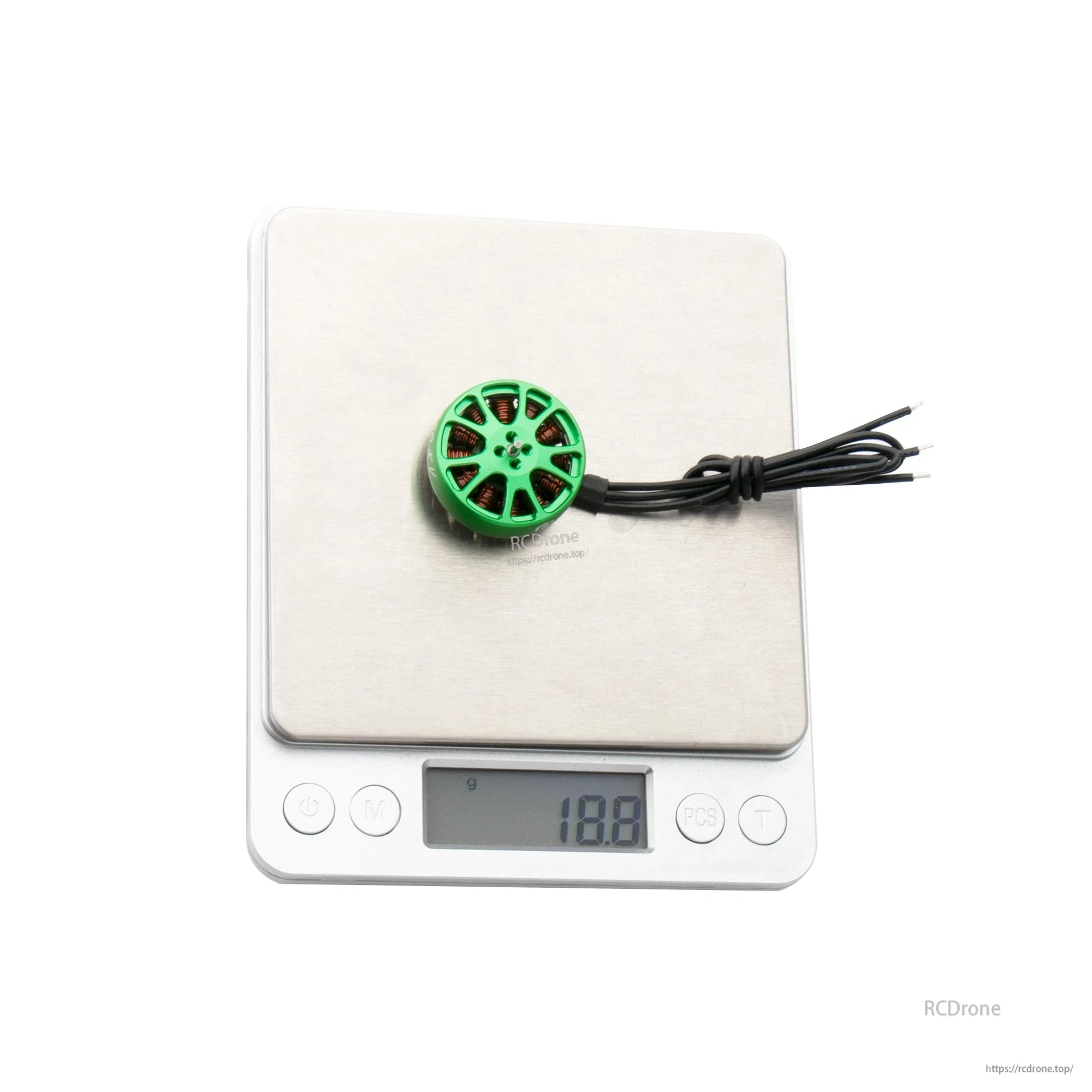 Flashhobby K2303 1750KV brushless motor with green top on a digital scale reading 18.8 g