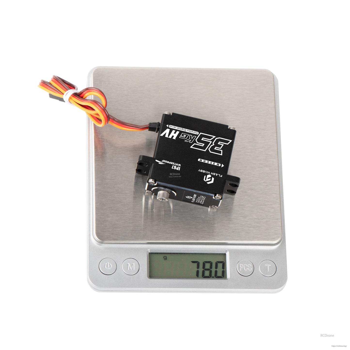 Flashhobby M35CHW coreless digital servo on a scale, black metal case with 3-wire lead, 78.0 g reading