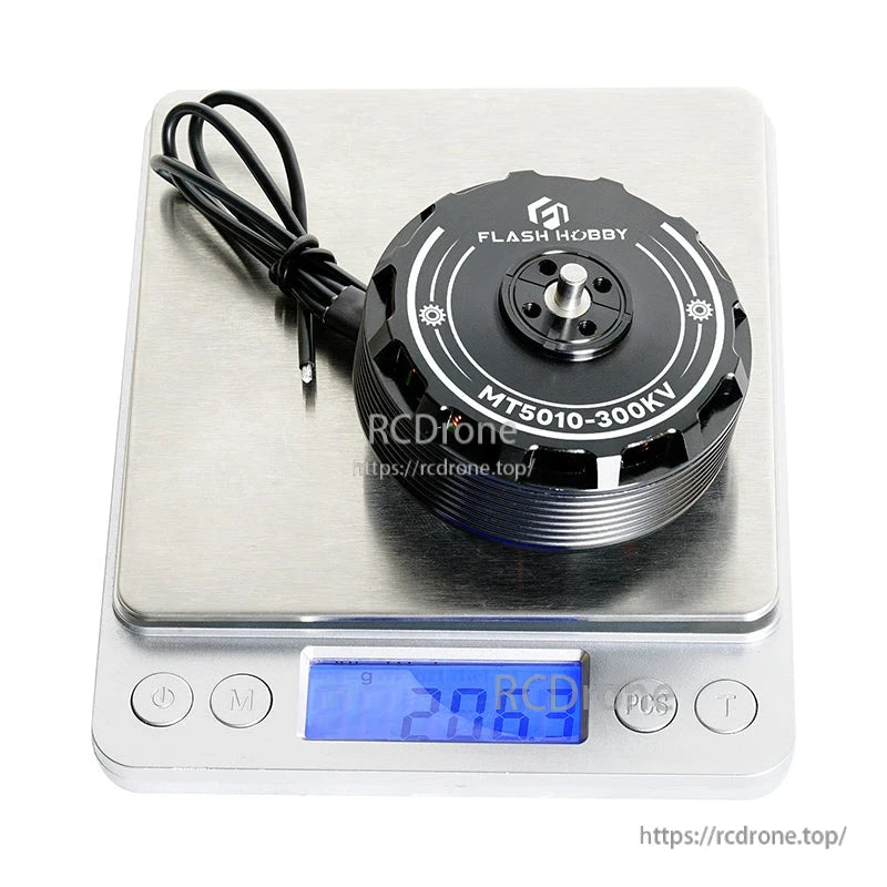 Flashhobby MT5010-300KV brushless DC motor with lead wires on a digital scale reading 208.59 g