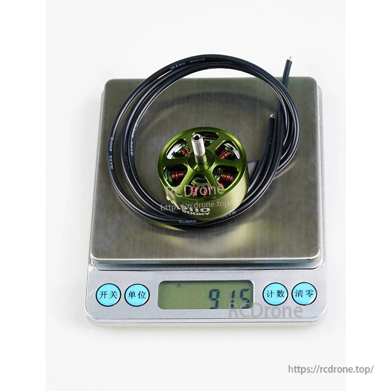 Flashhobby Mars 3110 900KV BLDC Motor, Flashhobby Mars 3110 900KV brushless motor with long lead wires sitting on a digital scale reading 91.6 g