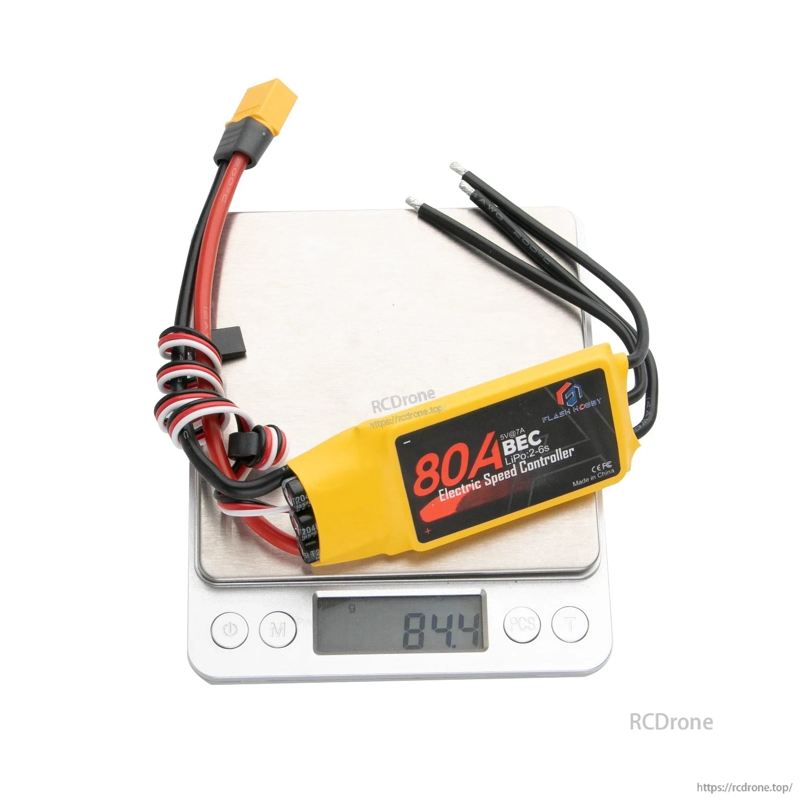Flashhobby Spaceman 80A ESC with 5V/7A BEC and battery connector, pictured on scale reading 84.4 g