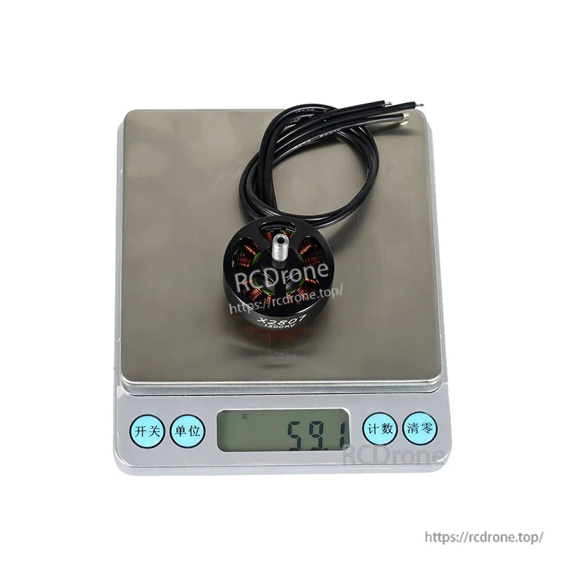 Flashhobby X2807 brushless DC motor with lead wires on a digital scale reading 59.1 g