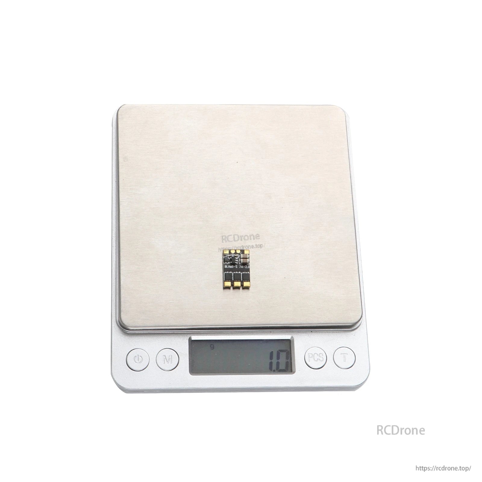 Micro BLHeli_S 7A brushless ESC board on digital scale, compact layout with solder pads, 1.0g reading