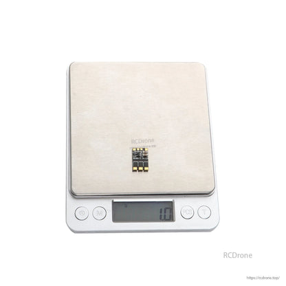 Micro BLHeli_S 7A brushless ESC board on digital scale, compact layout with solder pads, 1.0g reading