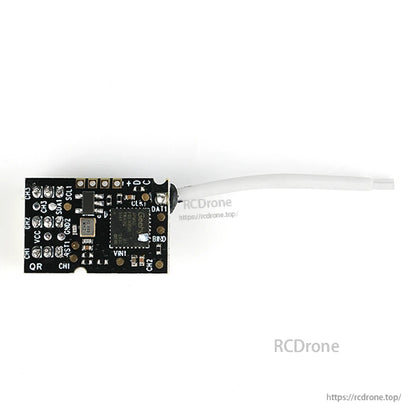 Back view in landscape orientation showing solder pad labels and antenna lead on right
