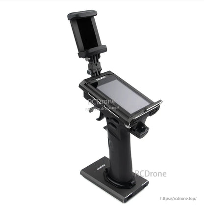 Transmitter rear-left view with raised phone holder above the screen and pistol-grip handle