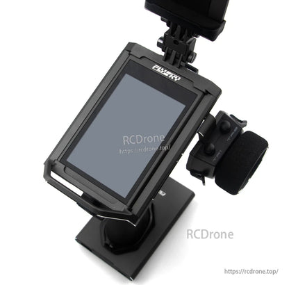 Top-down angled view of touchscreen with FlySky logo and phone holder bracket above
