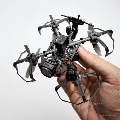 Flybee 16 HD O4 2S ultralight FPV quadcopter with prop guards and front camera, held in hand