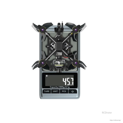 Flybee 16 HDZero 2S Ultralight FPV, Flybee 16 HDZero ultralight FPV quadcopter on a digital scale with the display reading 45.7 g