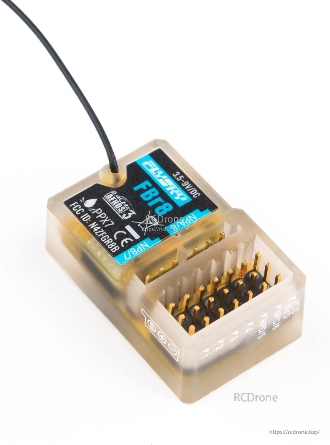 Angled close-up of FBr8 receiver showing 8-channel header pins and case markings