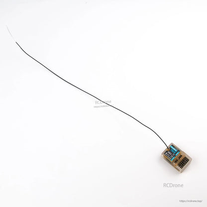 Wide shot of receiver with long black antenna wire extended on white background