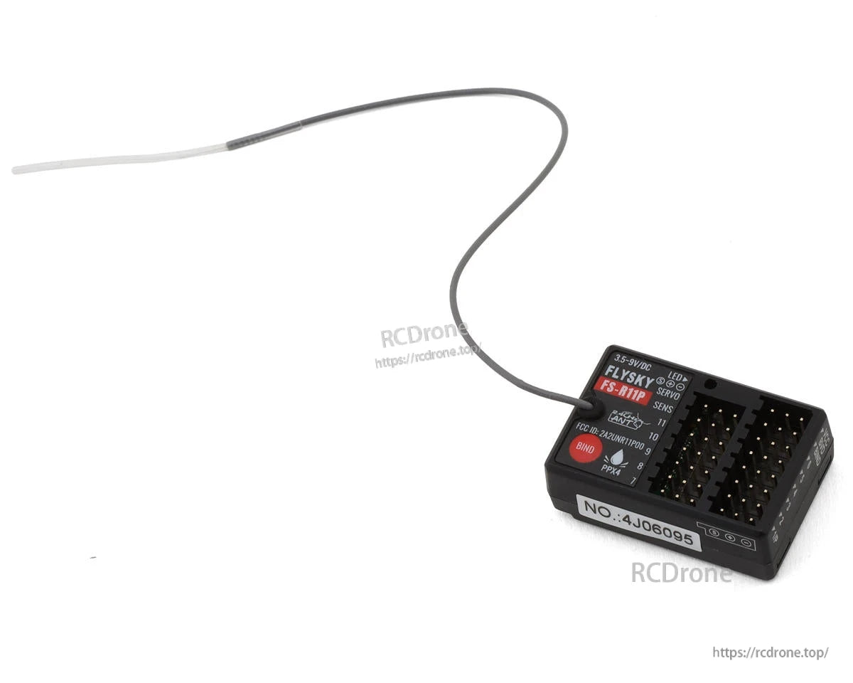 Flysky R11P receiver with long antenna lead and multi-pin port block, top label visible
