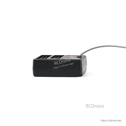 Low side profile of receiver showing case height and antenna routing along the edge
