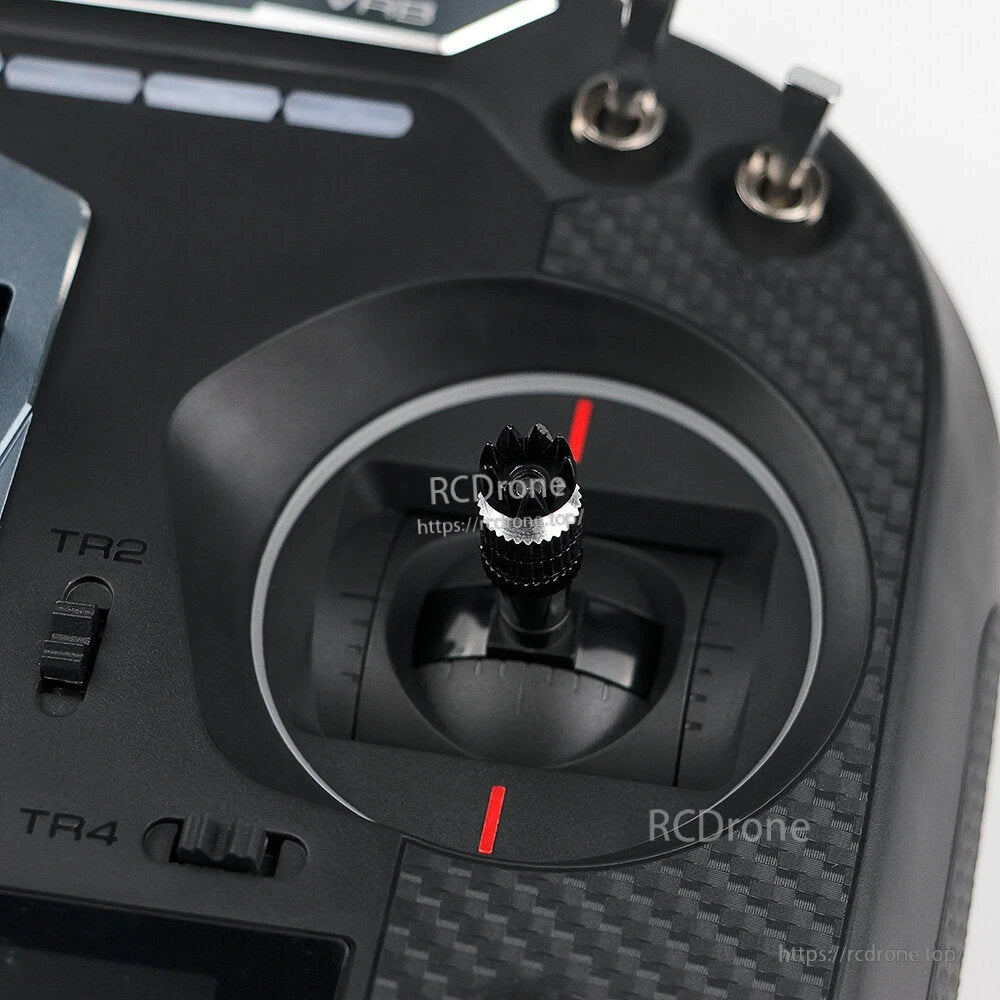 Right gimbal stick close-up on FS-ST16 transmitter showing stick end, red markers, and trim slider