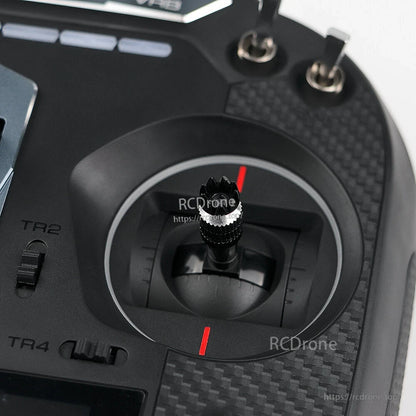 Right gimbal stick close-up on FS-ST16 transmitter showing stick end, red markers, and trim slider