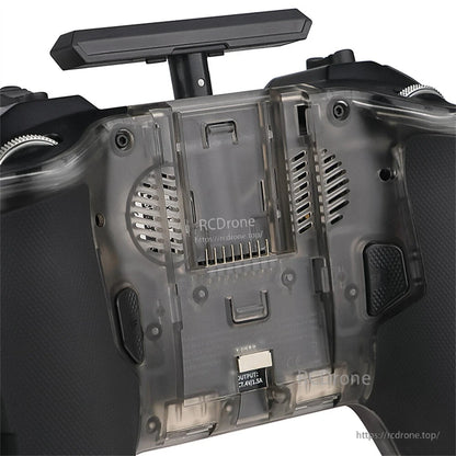 Rear view showing battery compartment cover, speaker vents, and bottom USB-C charging/output port