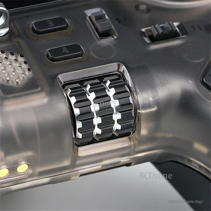 Close-up of dual scroll wheels/rollers and nearby buttons labeled 3 and 4 on the front panel