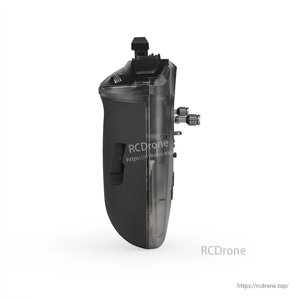 Side profile of the transmitter showing grip thickness, shoulder controls, and stick protrusion
