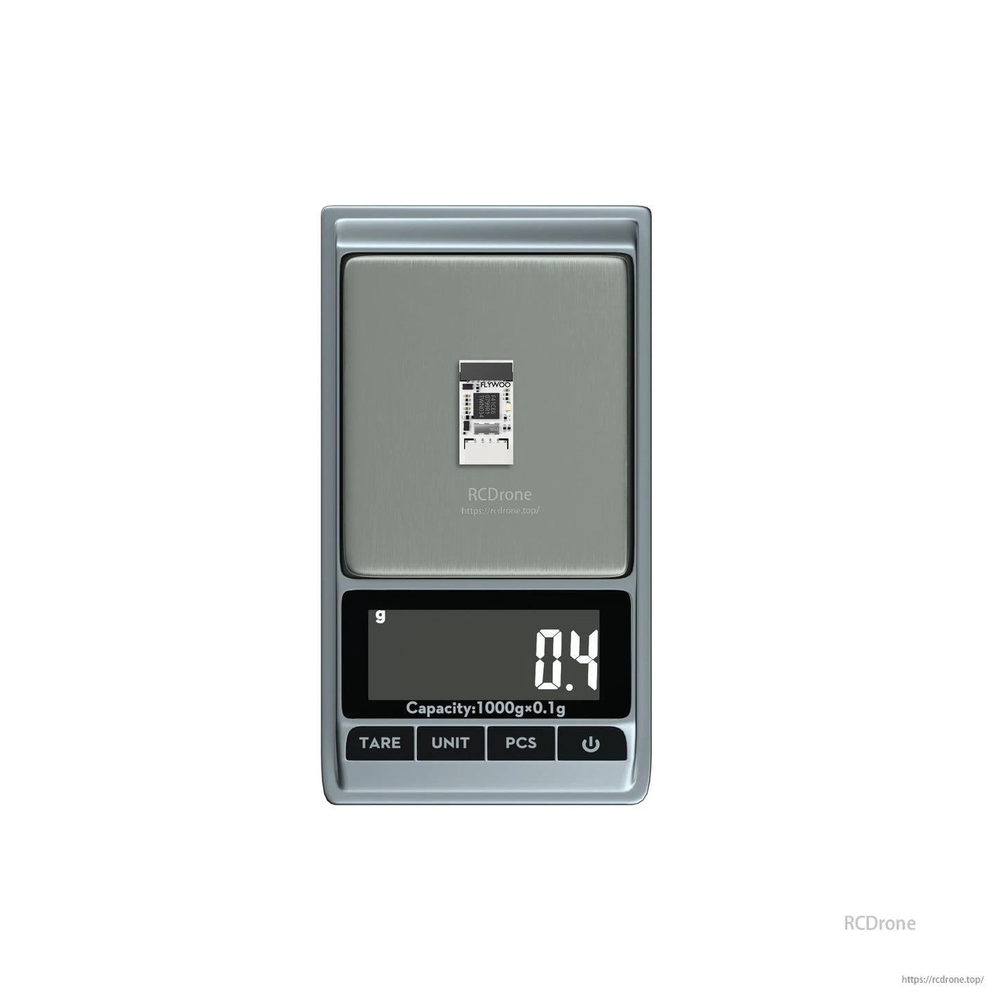 Flywoo Nano Black Box OpenLager module PCB on a digital scale, showing 0.4 g weight