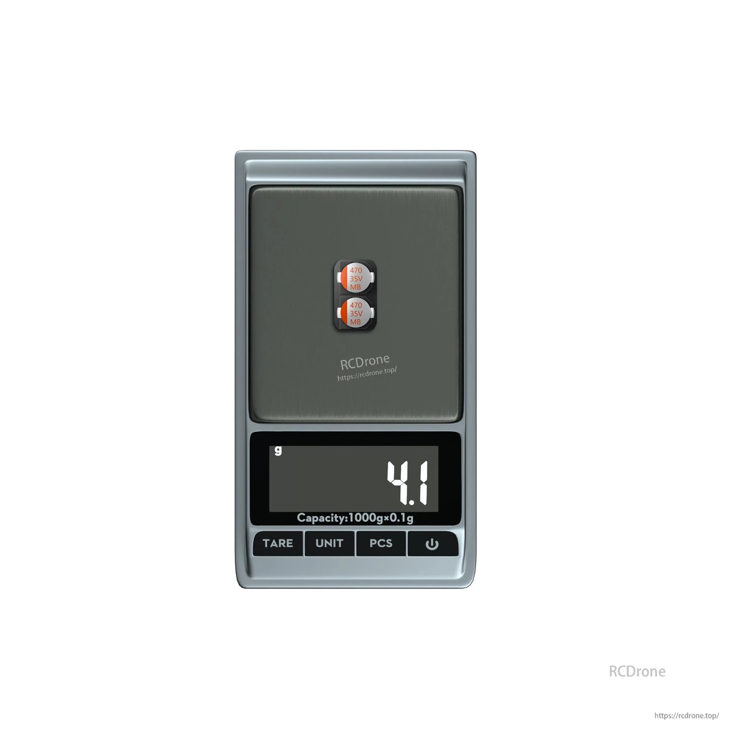 Two 470uF 35V electrolytic capacitors on a digital scale showing 4.1 g total weight