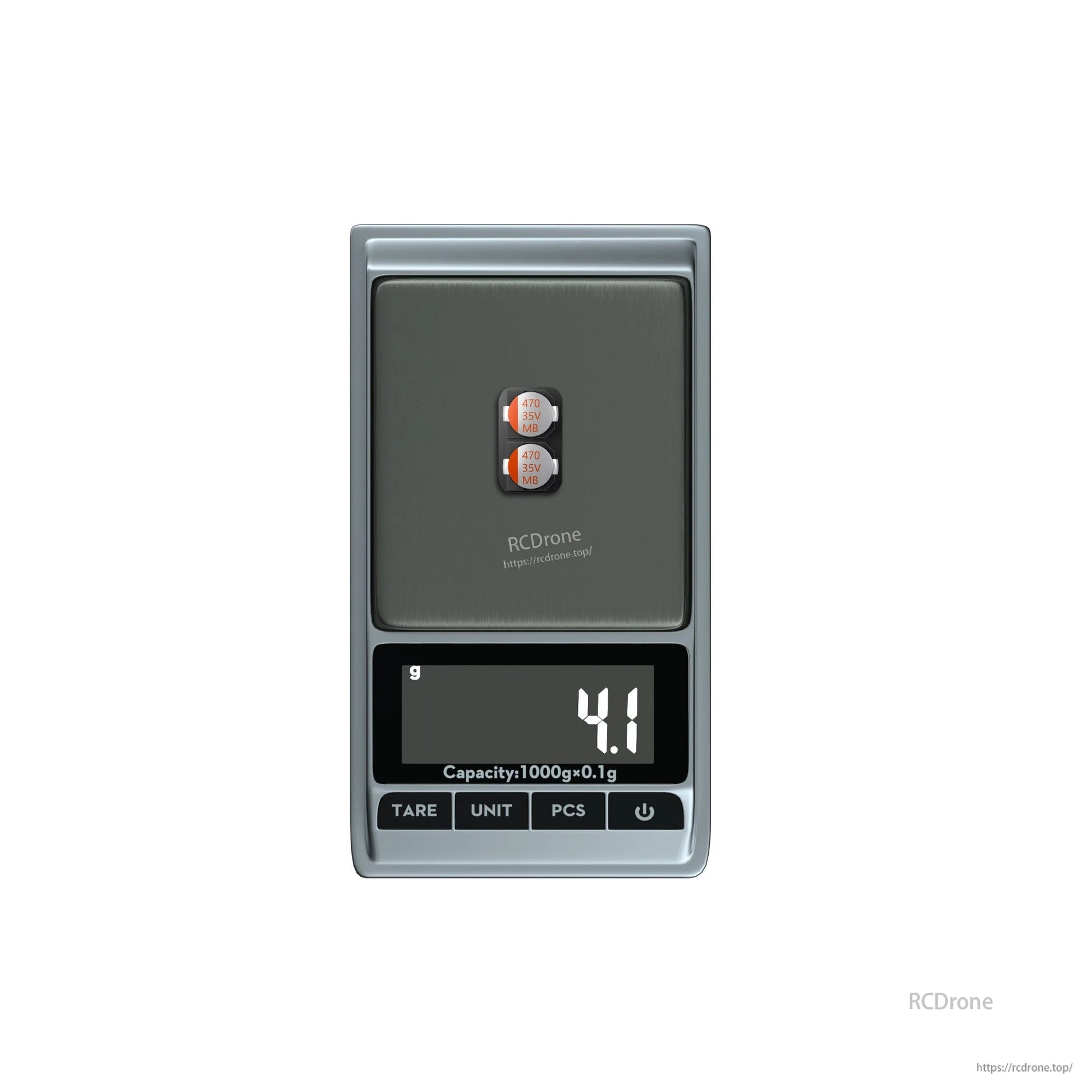 Two 470uF 35V electrolytic capacitors on a digital scale showing 4.1 g total weight
