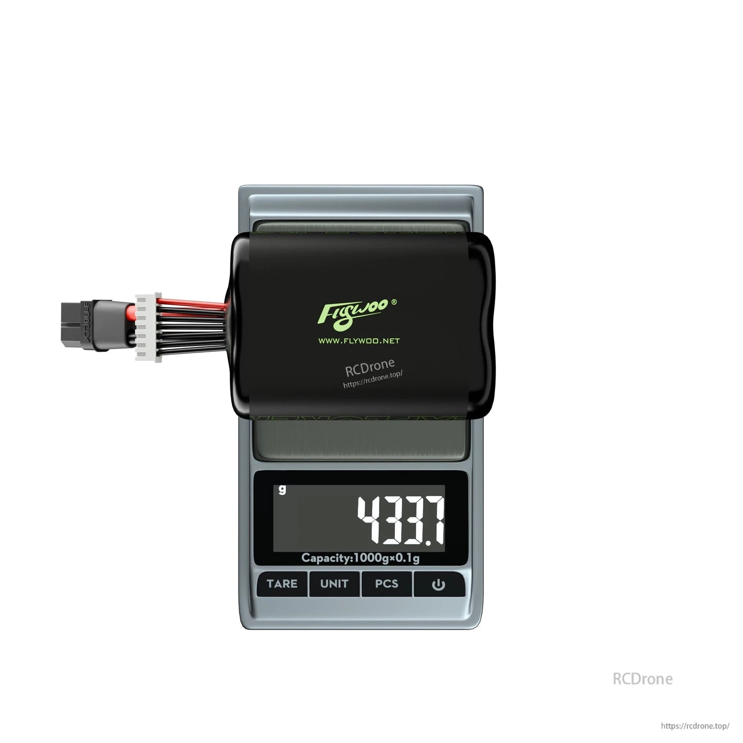 Flywoo Explorer 6S 21700 Li-ion battery pack with XT60 and balance lead on a scale reading 433.7 g