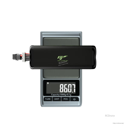 Flywoo Explorer Li-ion drone battery pack with XT60 and balance lead on digital scale reading 860.7 g
