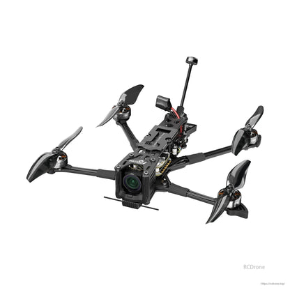 Flywoo Explorer LR 4-inch FPV quadcopter with carbon frame, front camera, four props, and rear antenna mast