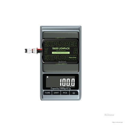 Flywoo Explorer Li-ion Battery, Explorer 18650 Li-ion battery pack (2S1P 7.4V 3000mAh) with lead connector on a scale reading 100.0 g