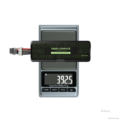 Flywoo Explorer 18650 Li-ion battery pack on a digital scale, labeled Molicel P30B 6000mAh 4S2P 14.8V