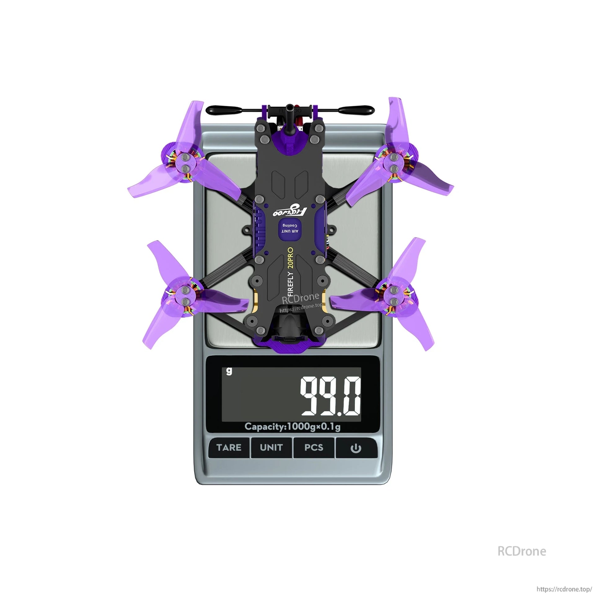Flywoo Firefly 20PRO micro FPV quadcopter with purple props on a digital scale reading 99.0 g
