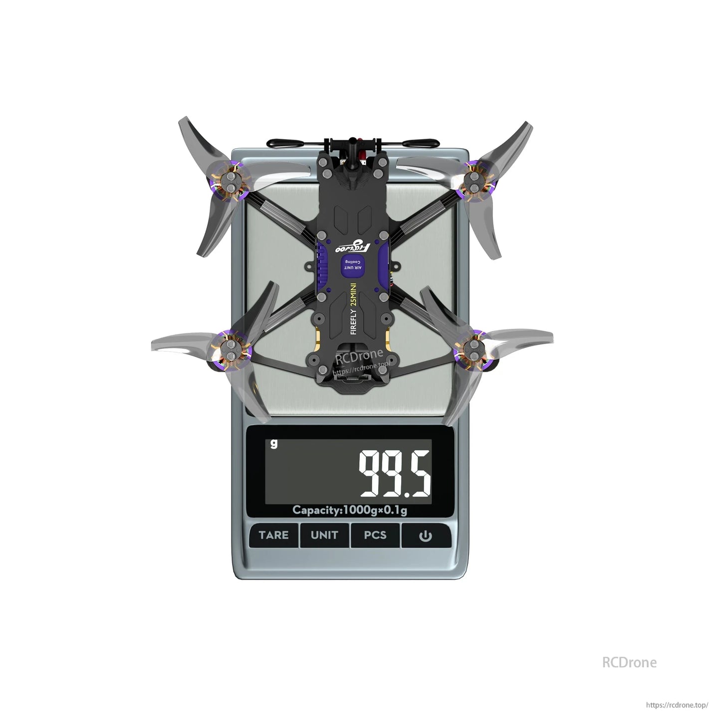 Flywoo Firefly 25MINI micro drone on a digital scale showing 99.5 g, top-down view with four props