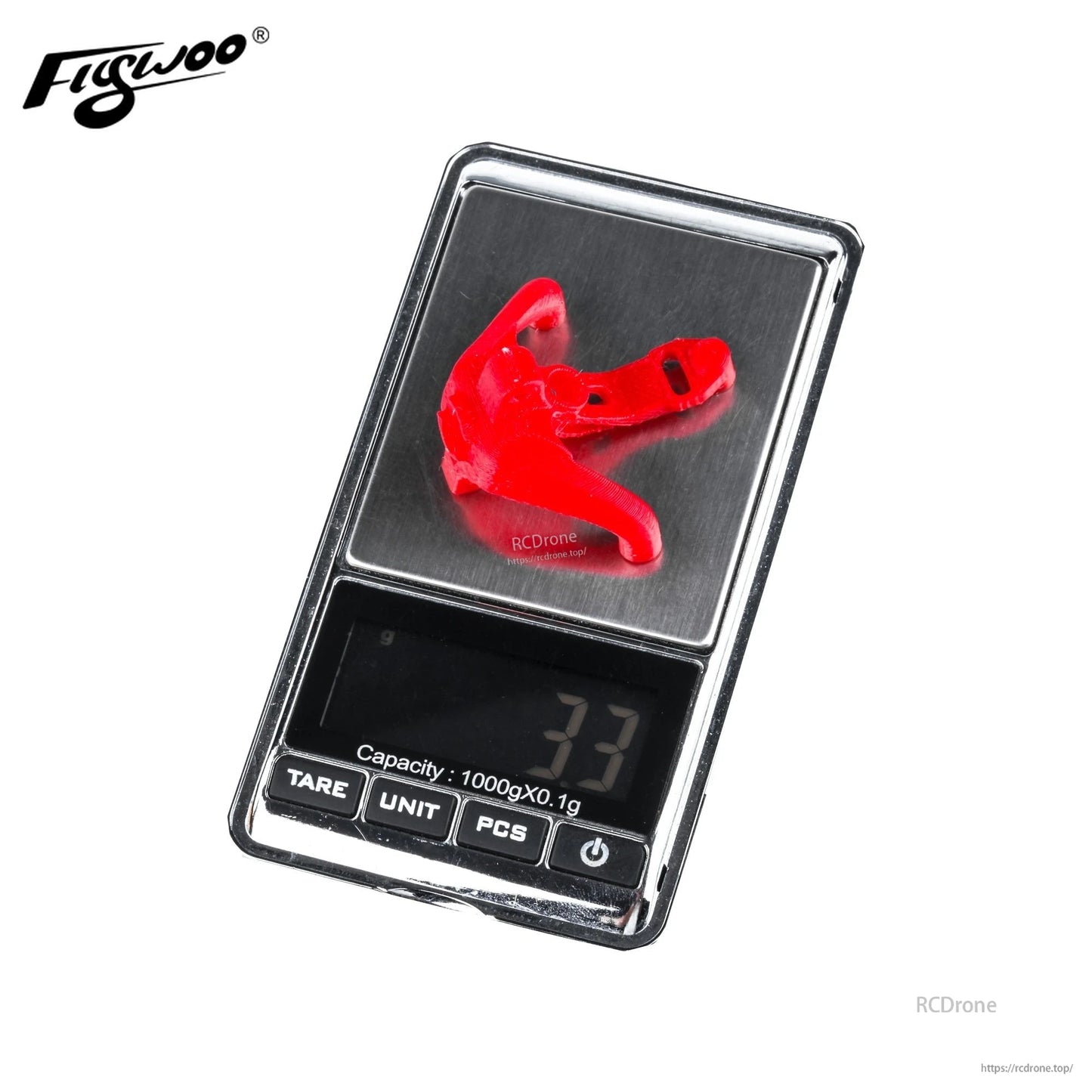 Red Flywoo Firefly Nano Baby 20 TPU canopy camera mount on a digital scale reading 3.3 g