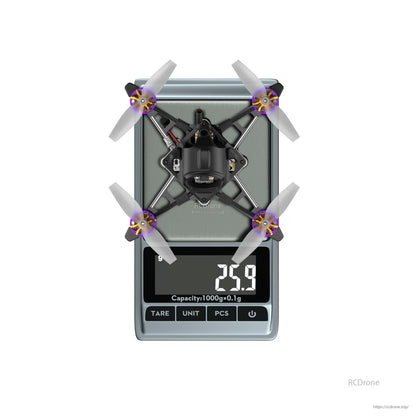 Flywoo Firefly18 nano quadcopter on a digital scale showing 25.9 g, top view with four propellers
