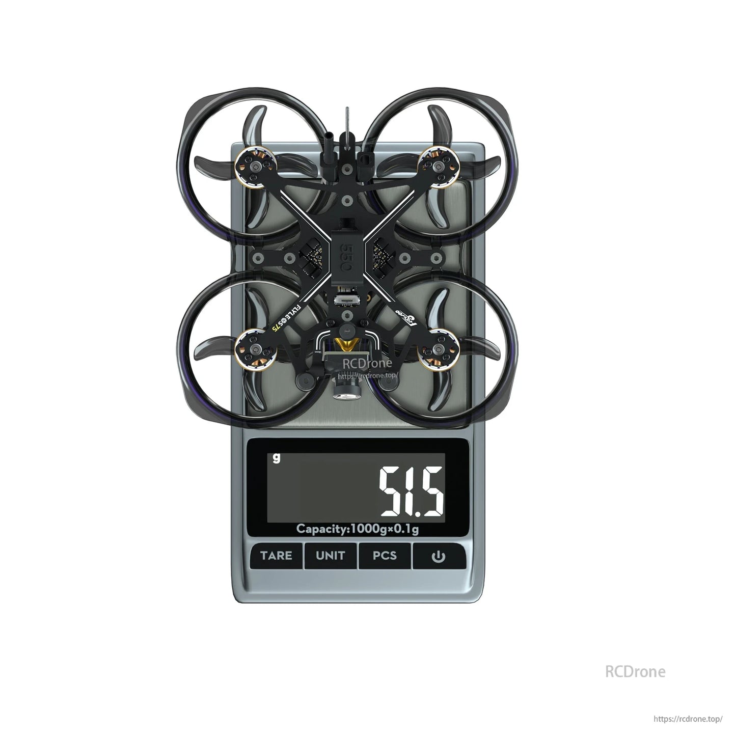 Flywoo FlyLens 75 HD whoop FPV drone on a digital scale, displaying 51.5 g weight reading