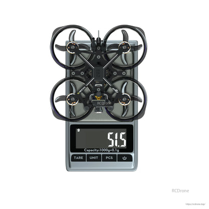 Flywoo FlyLens 75 HD whoop FPV drone on a digital scale, displaying 51.5 g weight reading