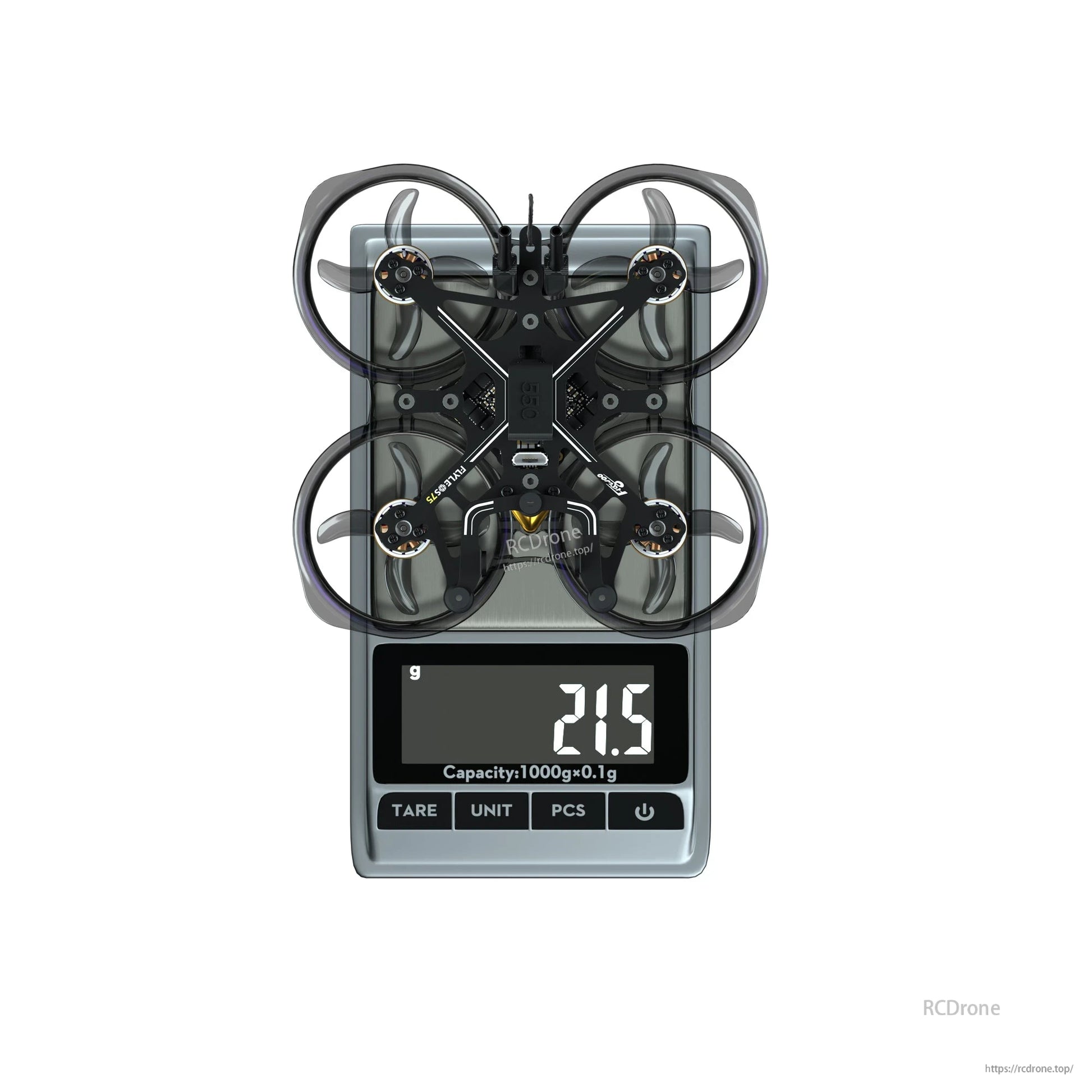 Flywoo FlyLens 75 whoop-style FPV drone on a digital scale with ducted prop guards, reading 21.5 g