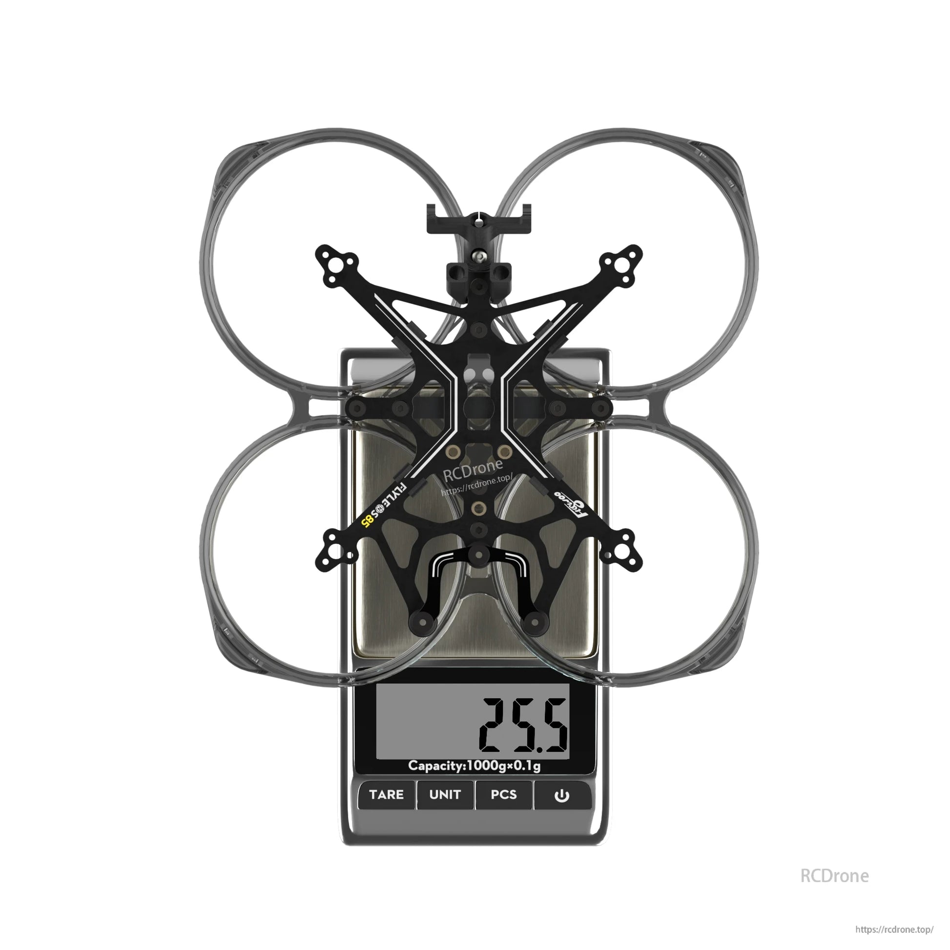 Flywoo FlyLens 85 2-inch whoop frame with PC duct ring on a digital scale showing 25.5 g