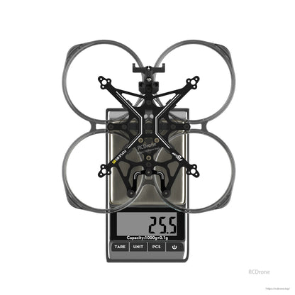 Flywoo FlyLens 85 2-inch whoop frame with PC duct ring on a digital scale showing 25.5 g