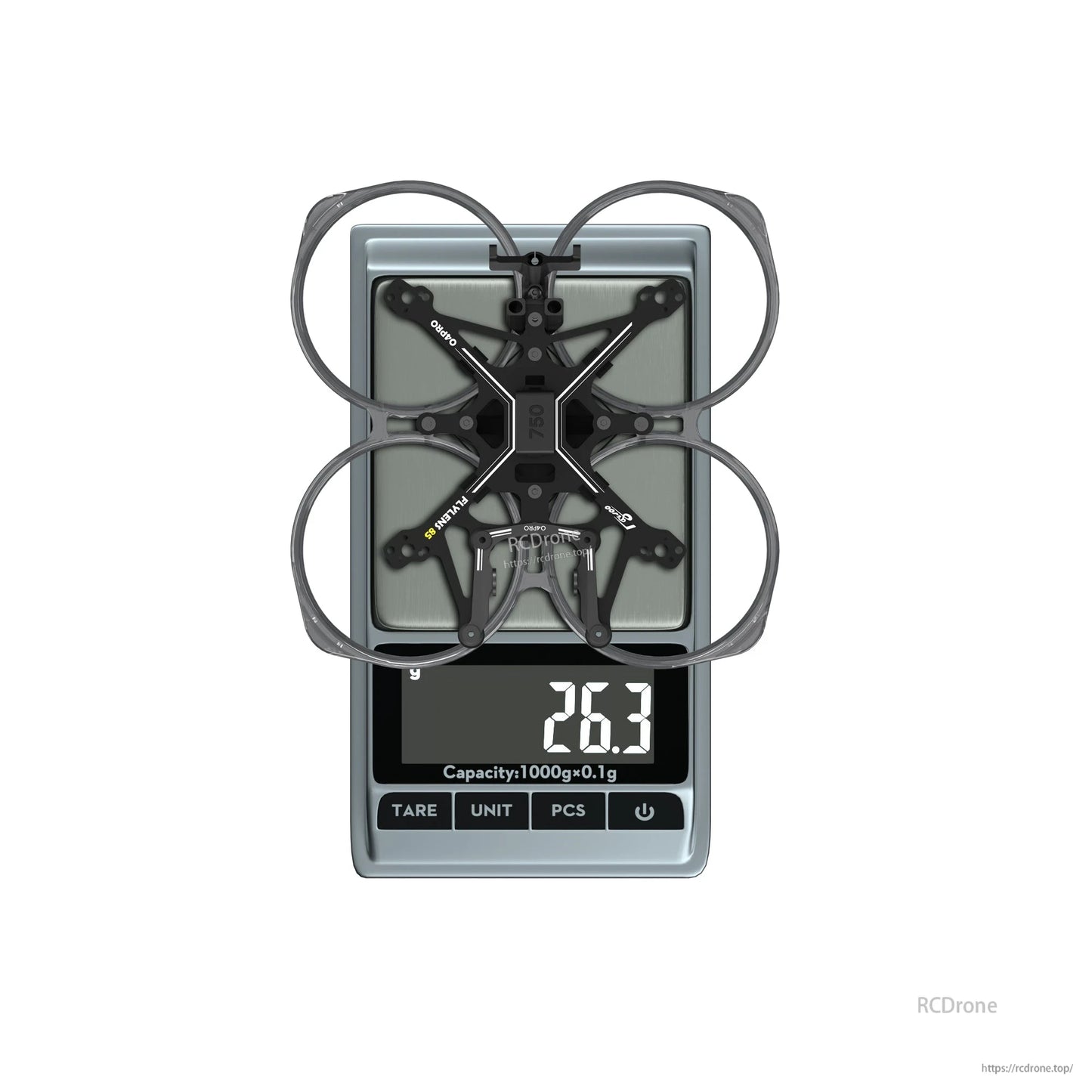 Flywoo FlyLens 85 2-inch whoop drone frame kit on a digital scale, showing 26.3 g weight