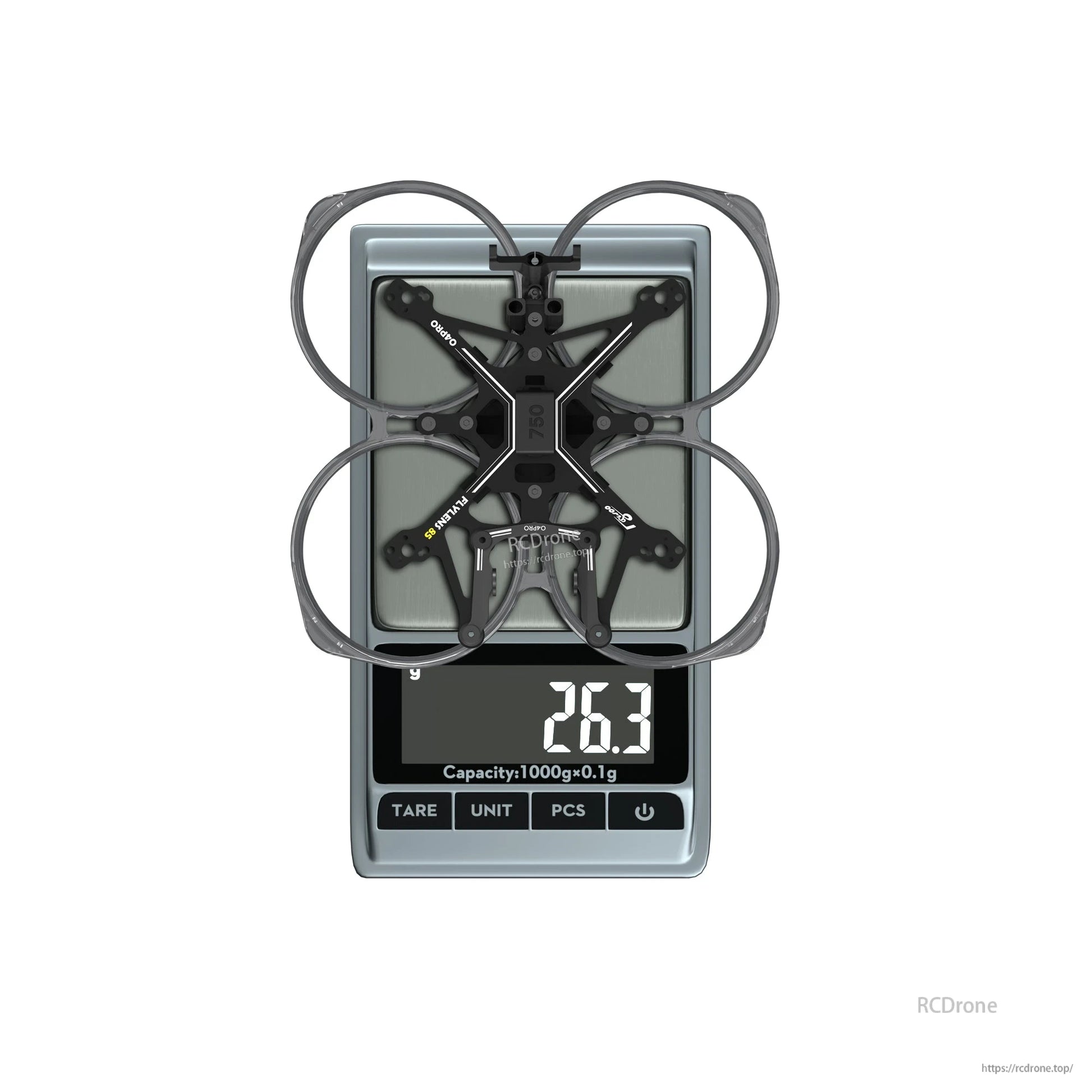 Flywoo FlyLens 85 2-inch whoop drone frame kit on a digital scale, showing 26.3 g weight