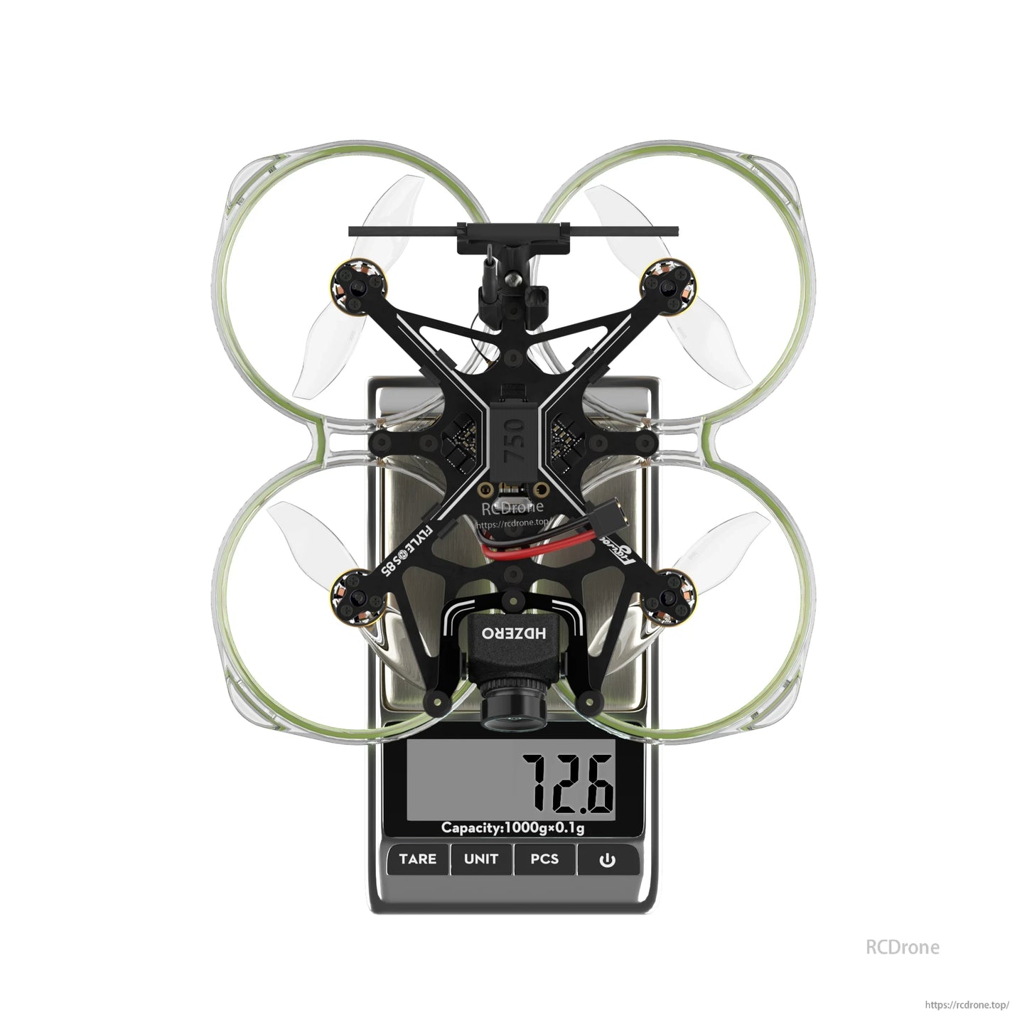 Flywoo FlyLens 85 HDZero whoop FPV drone on a digital scale, top view with ducted prop guards and 72.6g reading