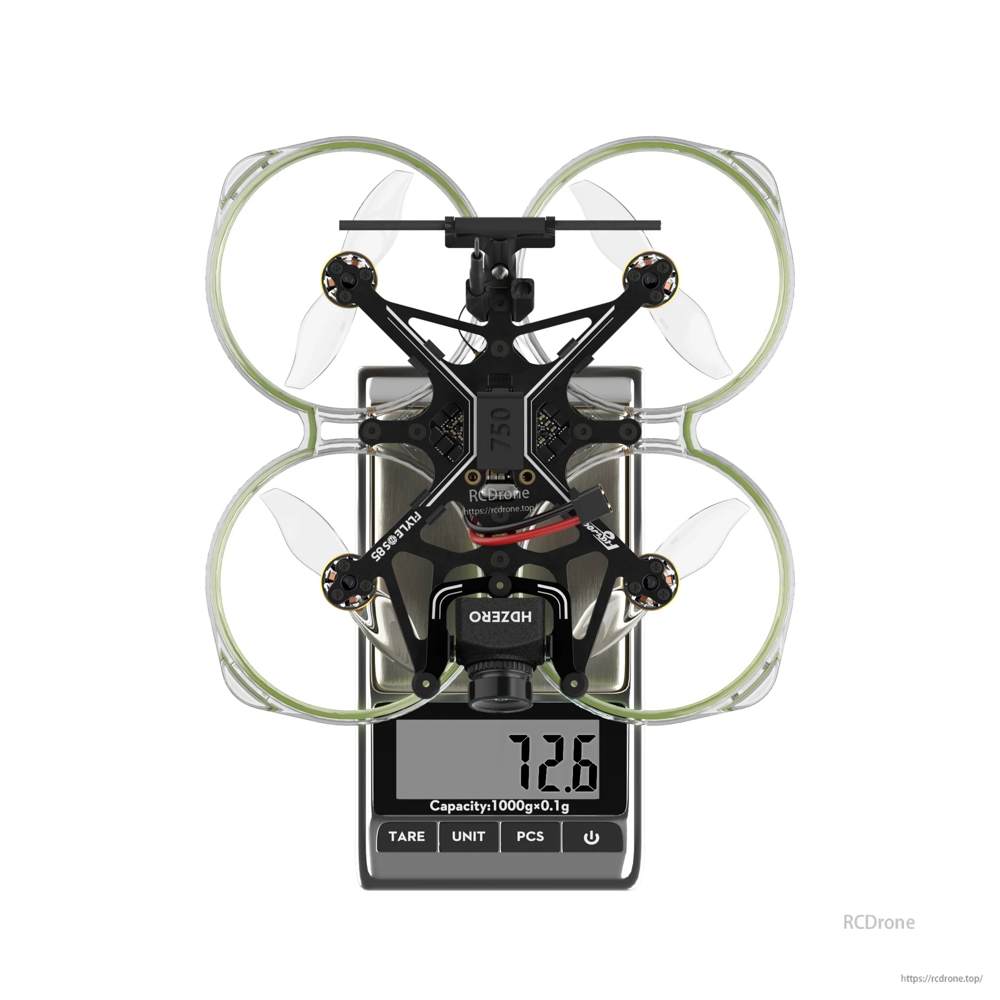 Flywoo FlyLens 85 HDZero whoop FPV drone on a digital scale, top view with ducted prop guards and 72.6g reading