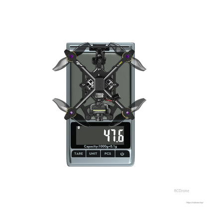 Flywoo Flybee 20 HD Walksnail 2S ultralight FPV drone on a digital scale showing 47.6 g weight