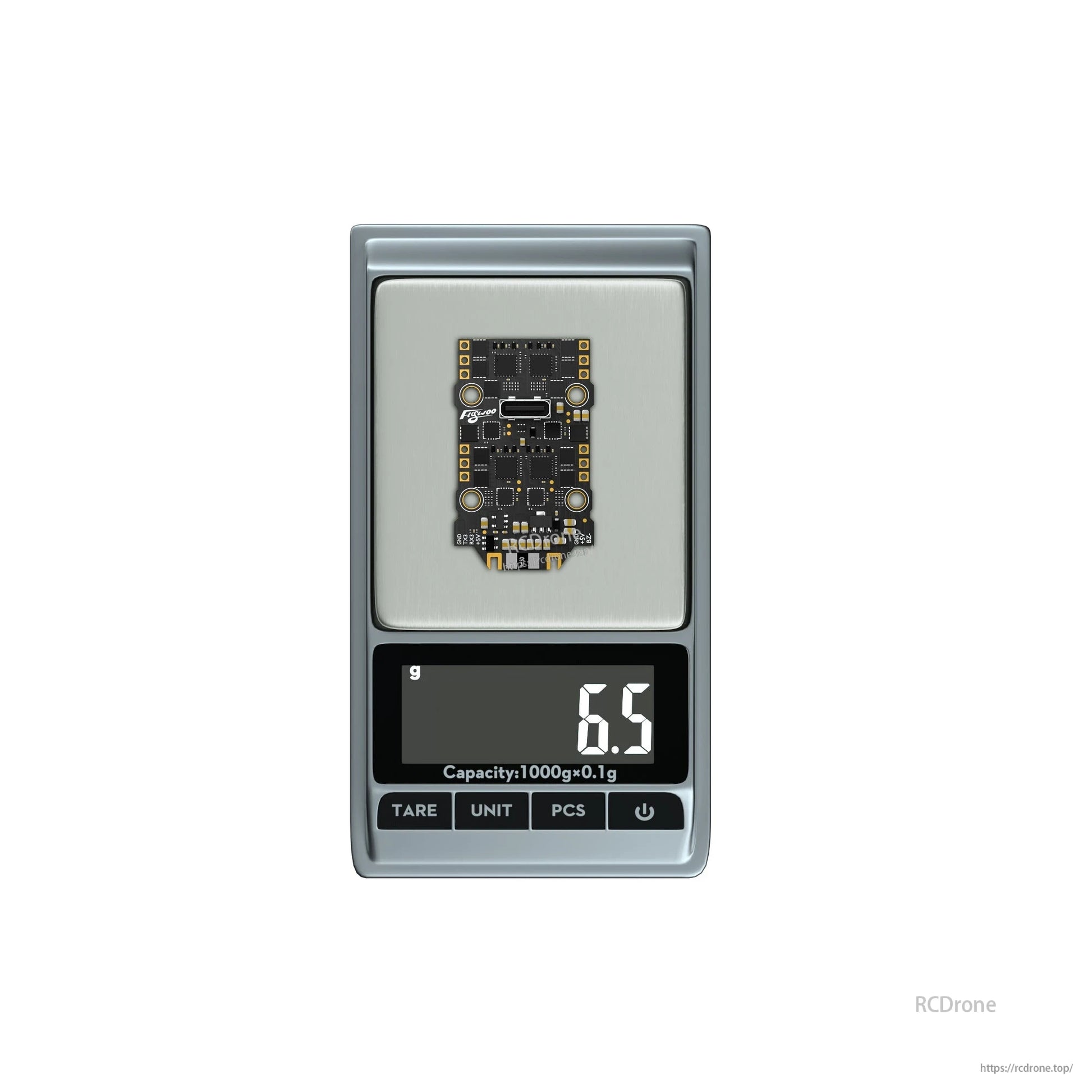 Flywoo GOKU F405 SE AIO flight controller and 4-in-1 ESC board on digital scale reading 6.5 g