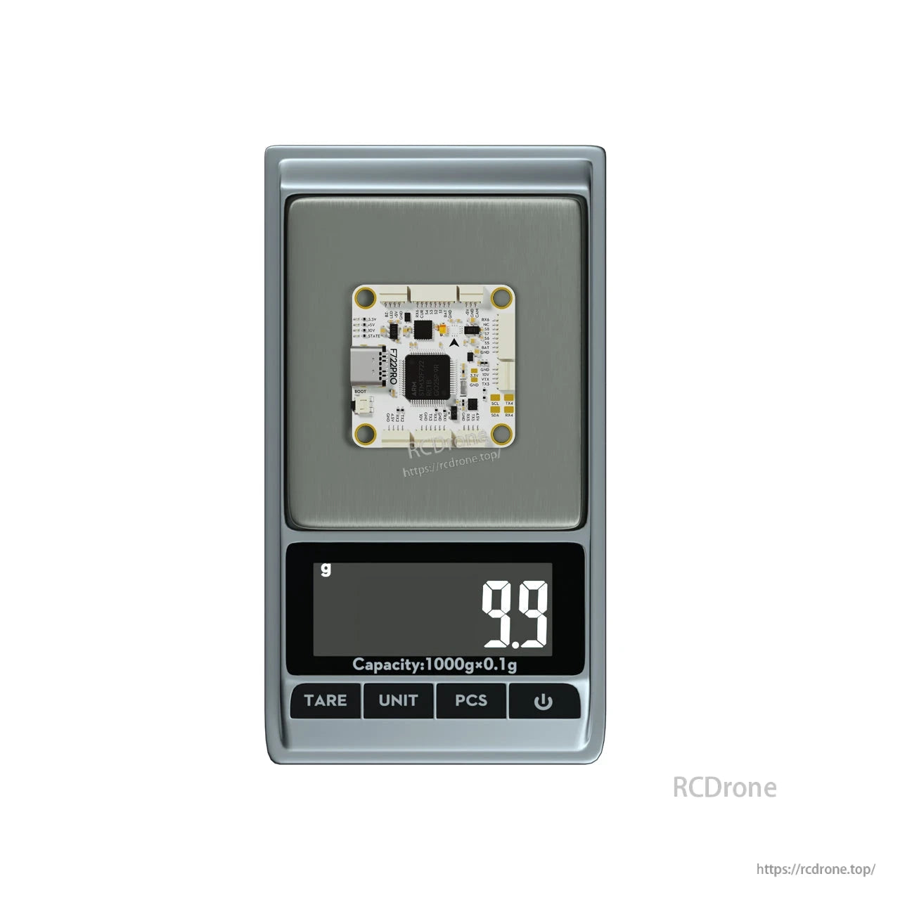 Flywoo GOKU F722 PRO V2 30x30 flight controller on a digital scale reading 9.9 g, compact white PCB with 30 mm mounting holes.