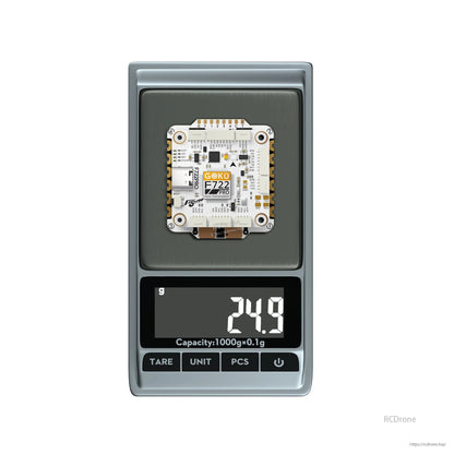 Flywoo GOKU F722 Pro flight controller board on a digital scale reading 24.9 g